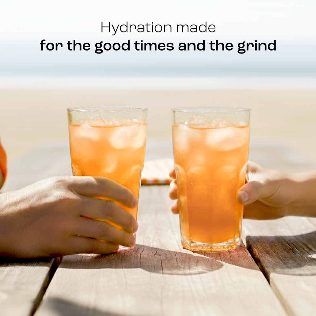 Two glasses of orange electrolyte drink made with electrolyte recovery plus powder
