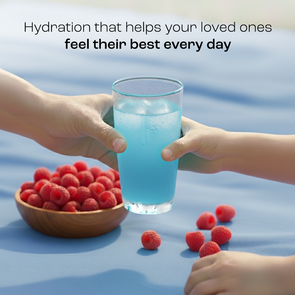 Blue electrolyte drink in a glass held with raspberries in a bowl