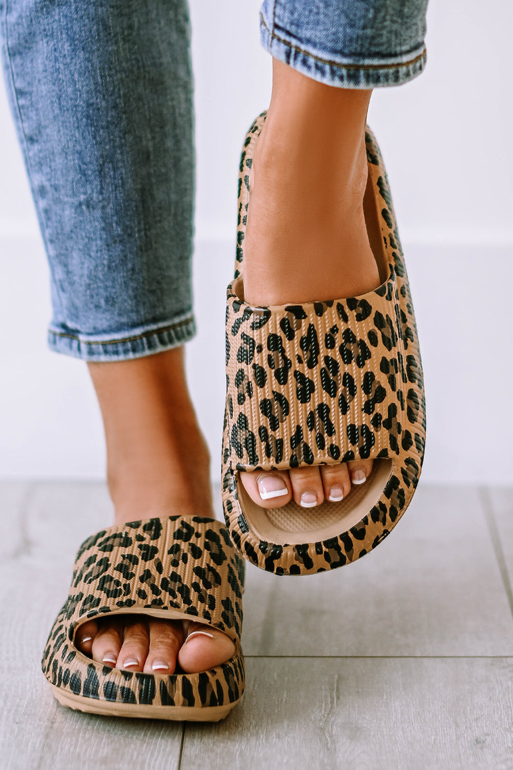 Leopard print slip-on slippers worn with cuffed jeans, open toe view