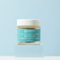 Restore nail restoration balm jar with white lid and teal label