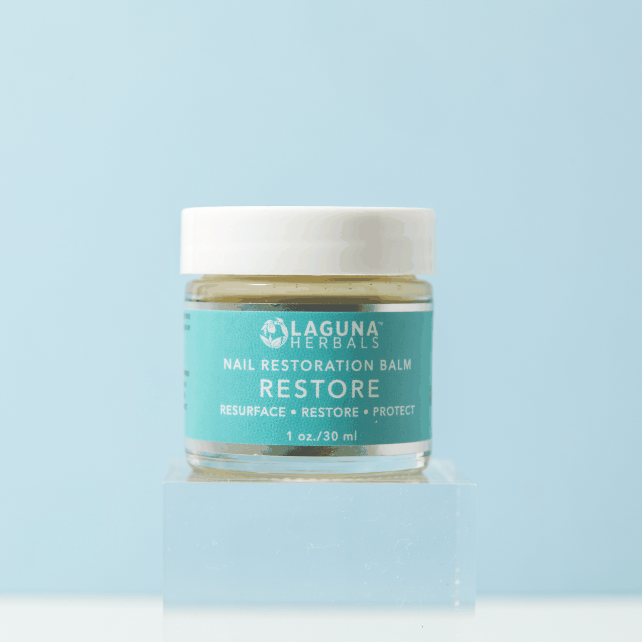 Restore nail restoration balm jar with white lid and teal label