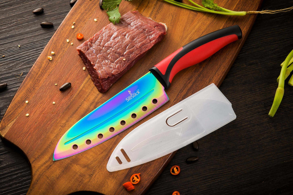 Chef-style knife with red handle and rainbow blade, plus clear sheath