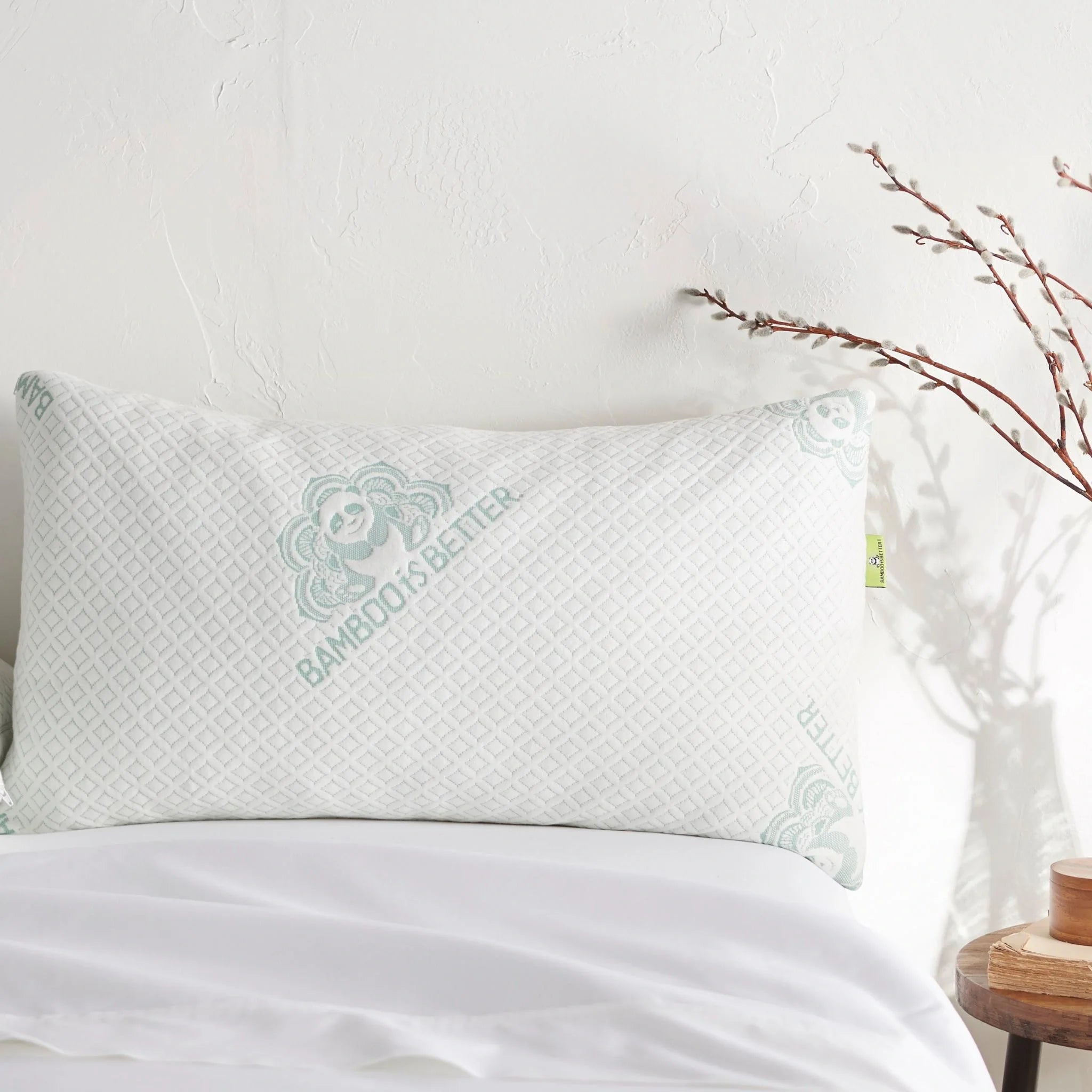 Adjustable bamboo cooling pillow, white cushion with mint logo and subtle textured weave