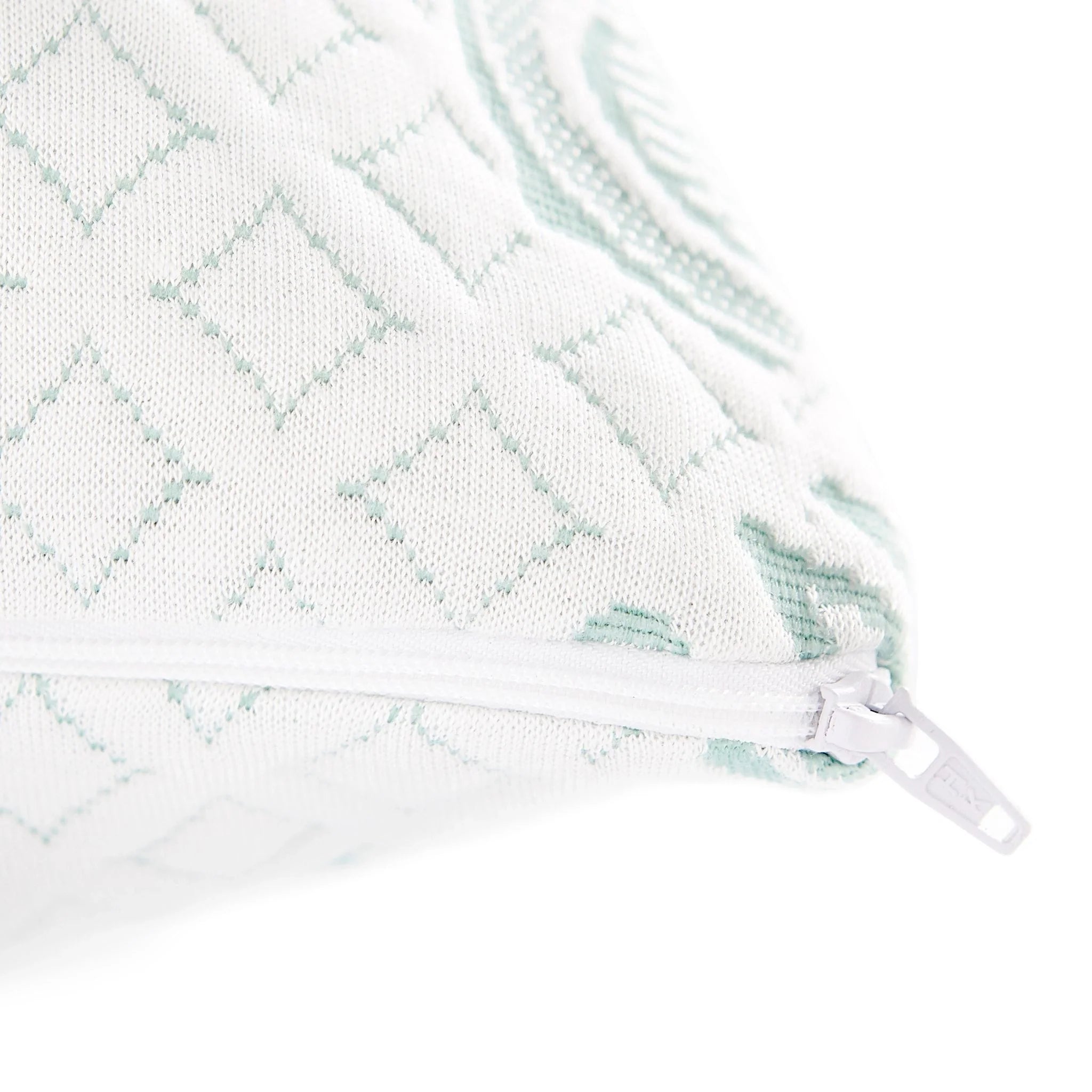 Pillow cover zipper with mint pattern accents on the edge of the adjustable pillow