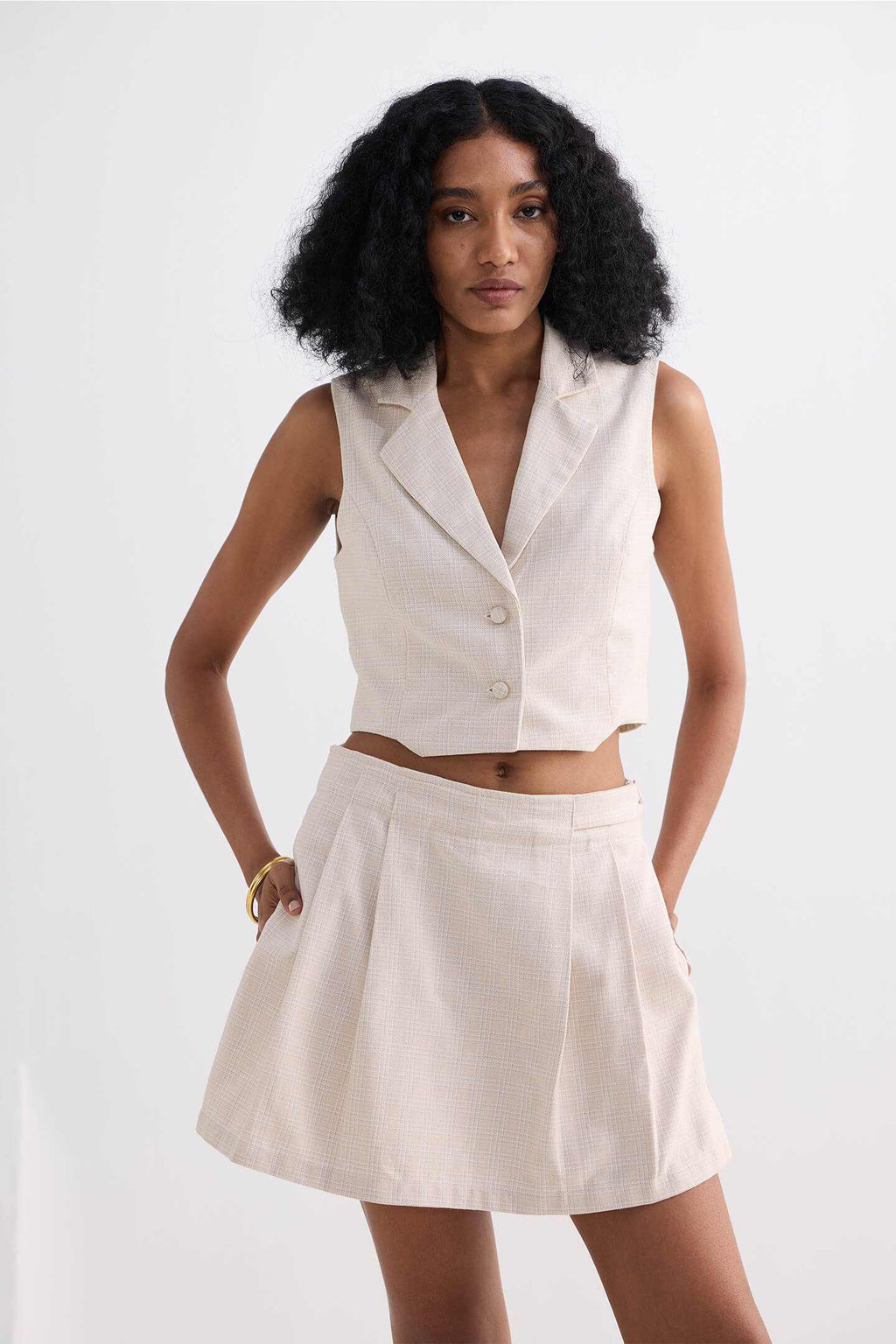 Cream cotton tweed skort, structured waistband with pleated skirt panels