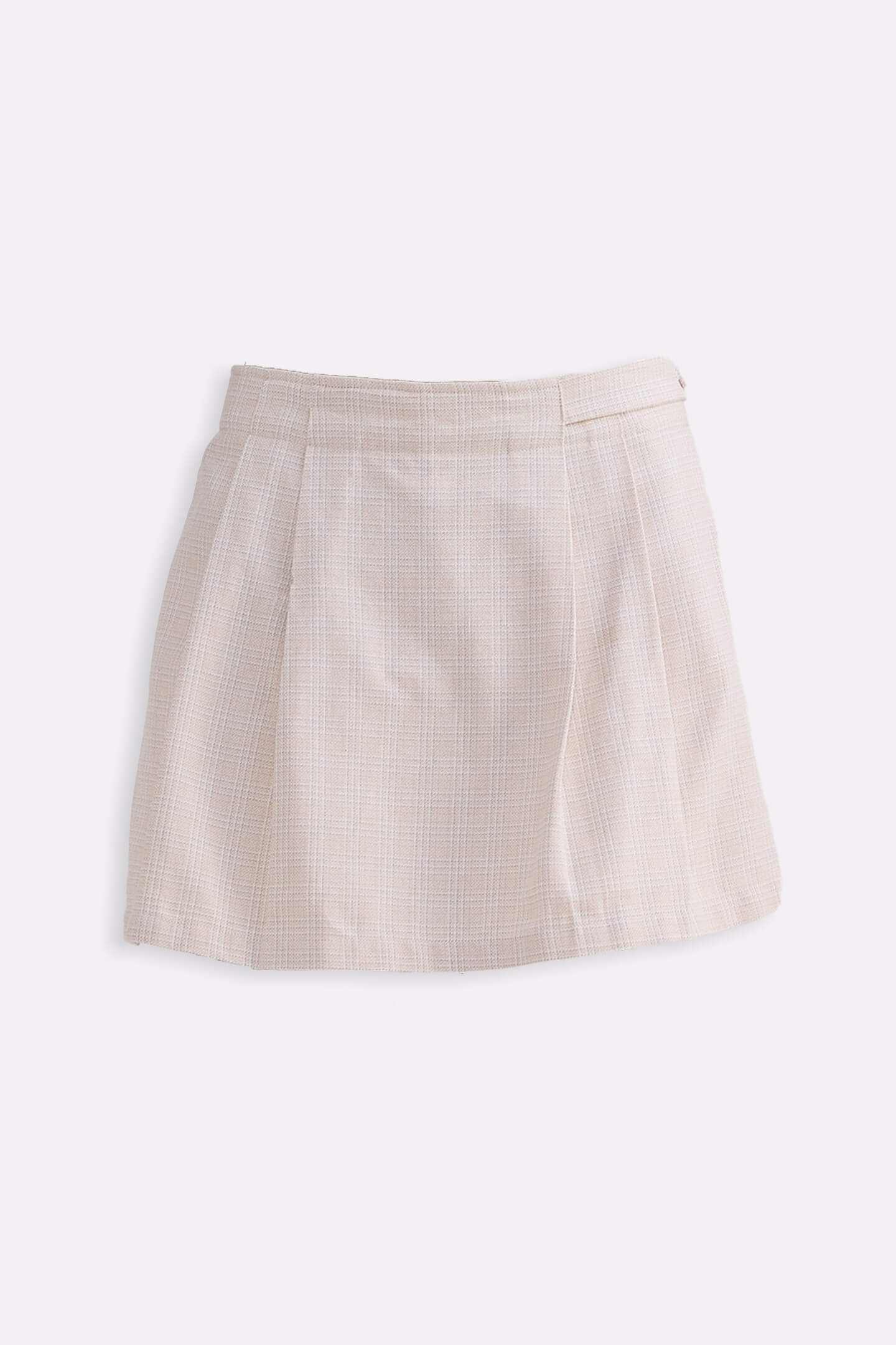 Cream cotton tweed skort shown laid flat, pleated A-line front