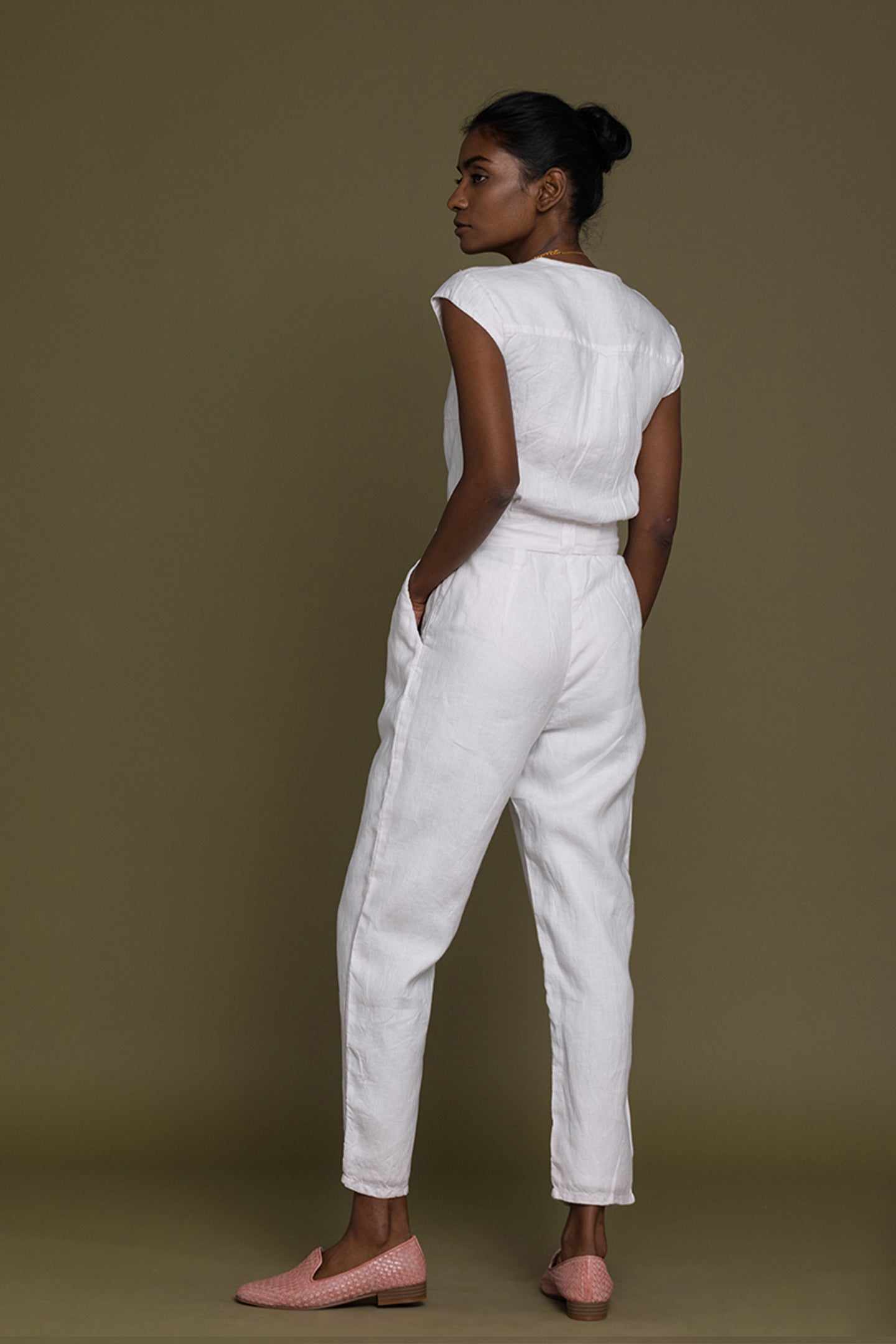 Evening Chai jumpsuit white, side view; short sleeves, tie-belt waist, tapered cropped legs