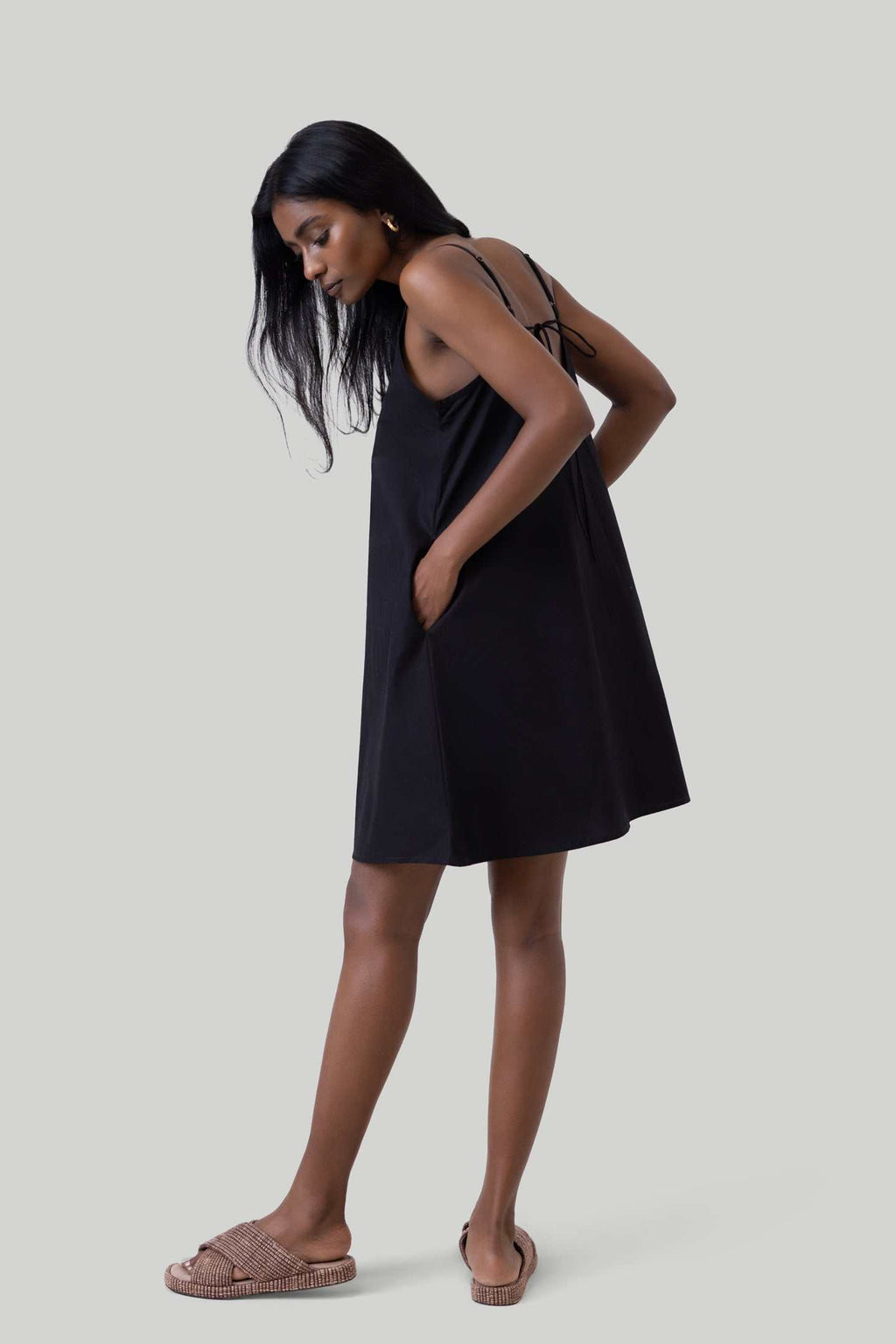 Black short tent dress, V-neck front and relaxed A-line silhouette