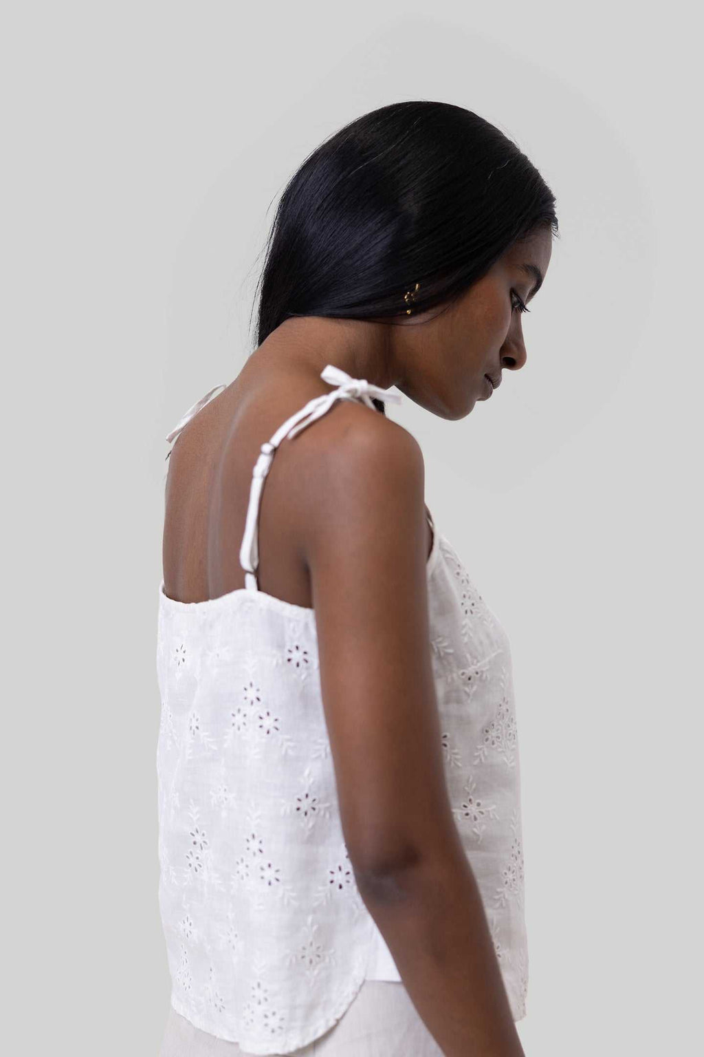 White embroidered camisole side view with adjustable tie shoulder straps