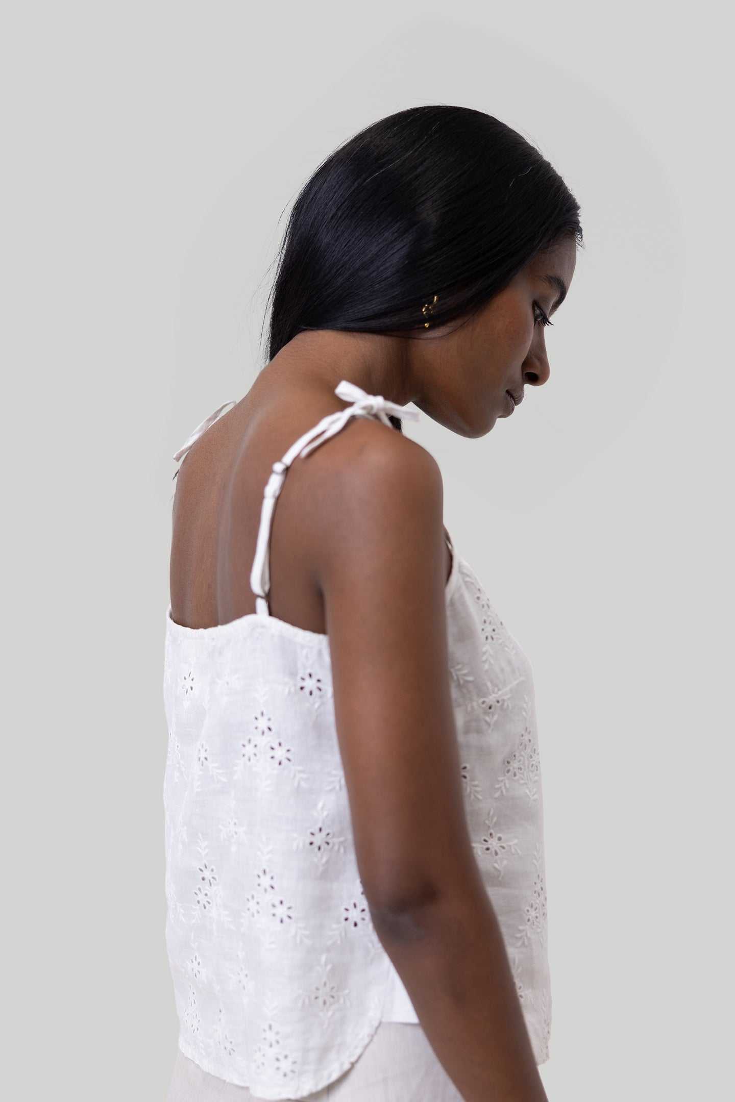 White embroidered camisole side view with adjustable tie shoulder straps