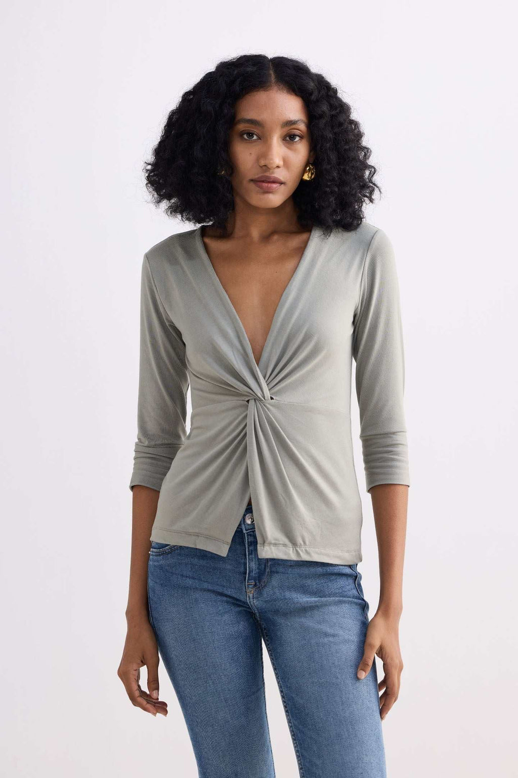 Light olive knit shirt with twist-front V-neck, 3/4 sleeves