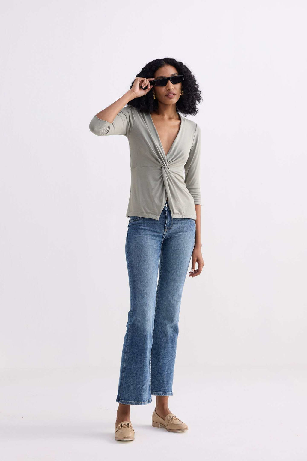 Light olive twist-front knit shirt, crossover knot at chest, 3/4 sleeves
