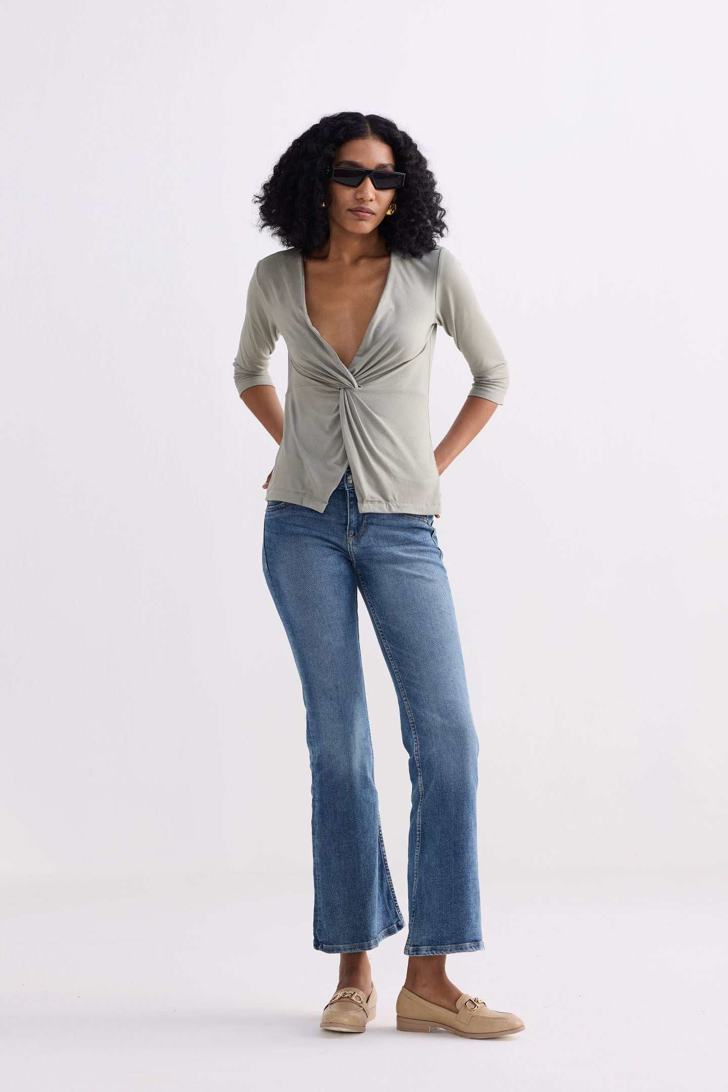 Light olive knit top with twist-front V-neck, 3/4 sleeves