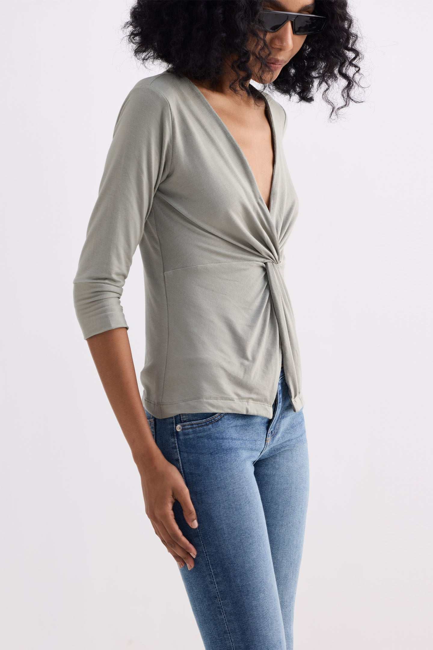 Light olive knit shirt, draped twist-front, open V neckline, 3/4 sleeves
