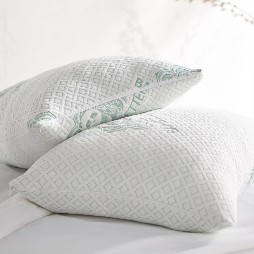 Adjustable bamboo cooling pillow pair with white covers and mint lattice side panels