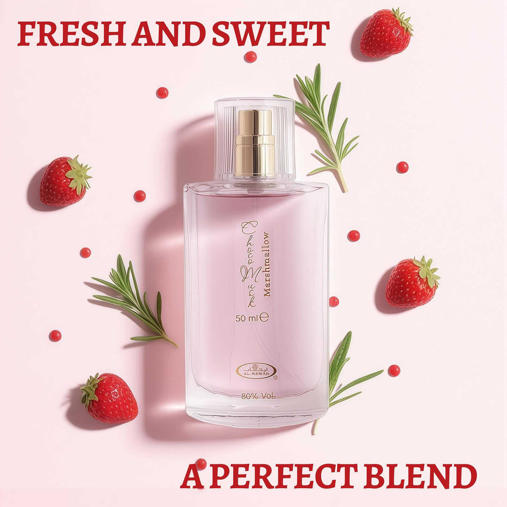 Clear square perfume bottle with gold atomizer and label; strawberries around