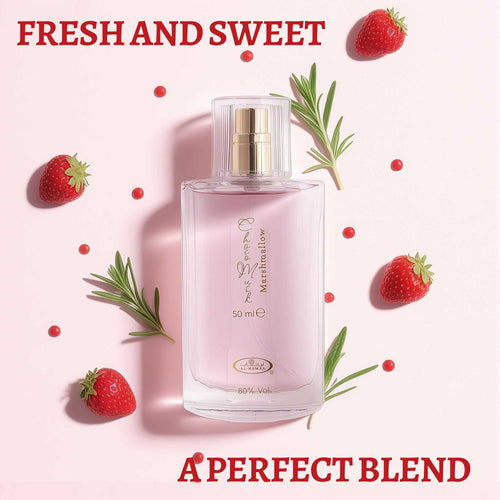 Clear square perfume bottle with gold atomizer and label; strawberries around