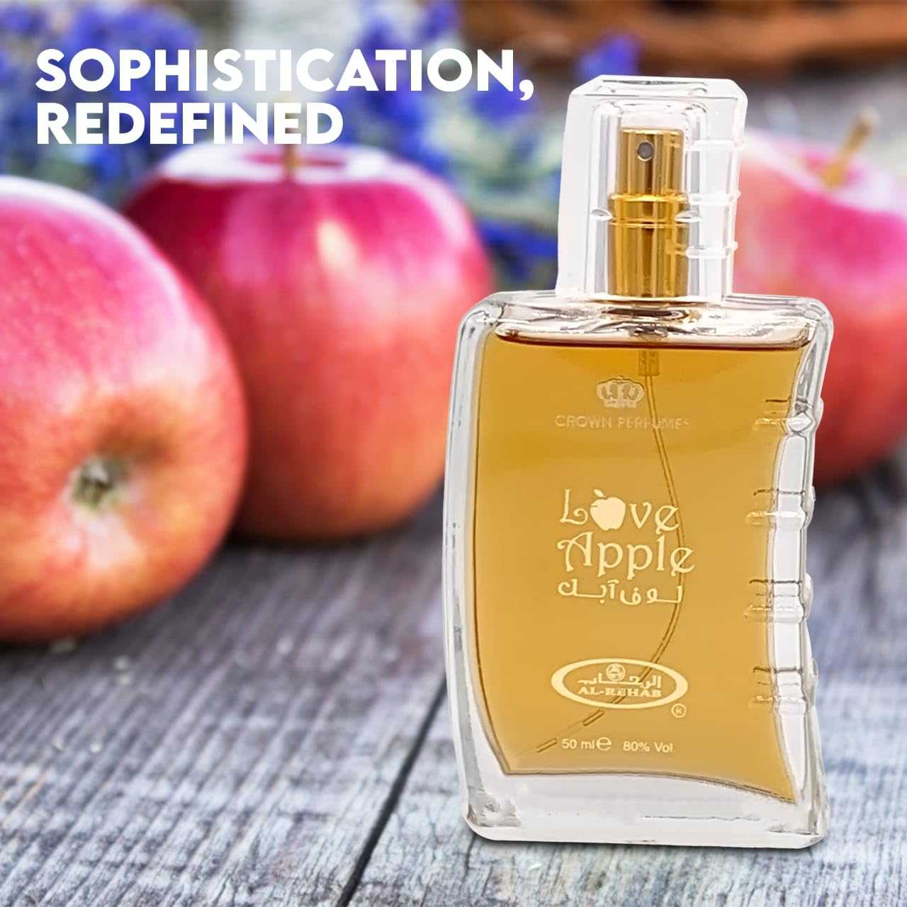 Clear square perfume bottle with gold “Love Apple” label and gold spray