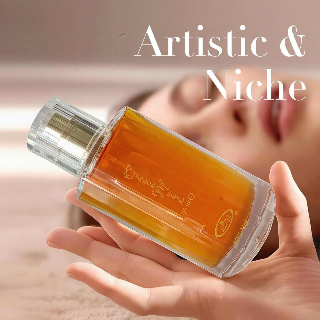 Choco Musk Eau de Toilette bottle held in hand, orange liquid, clear cap, 50 ml