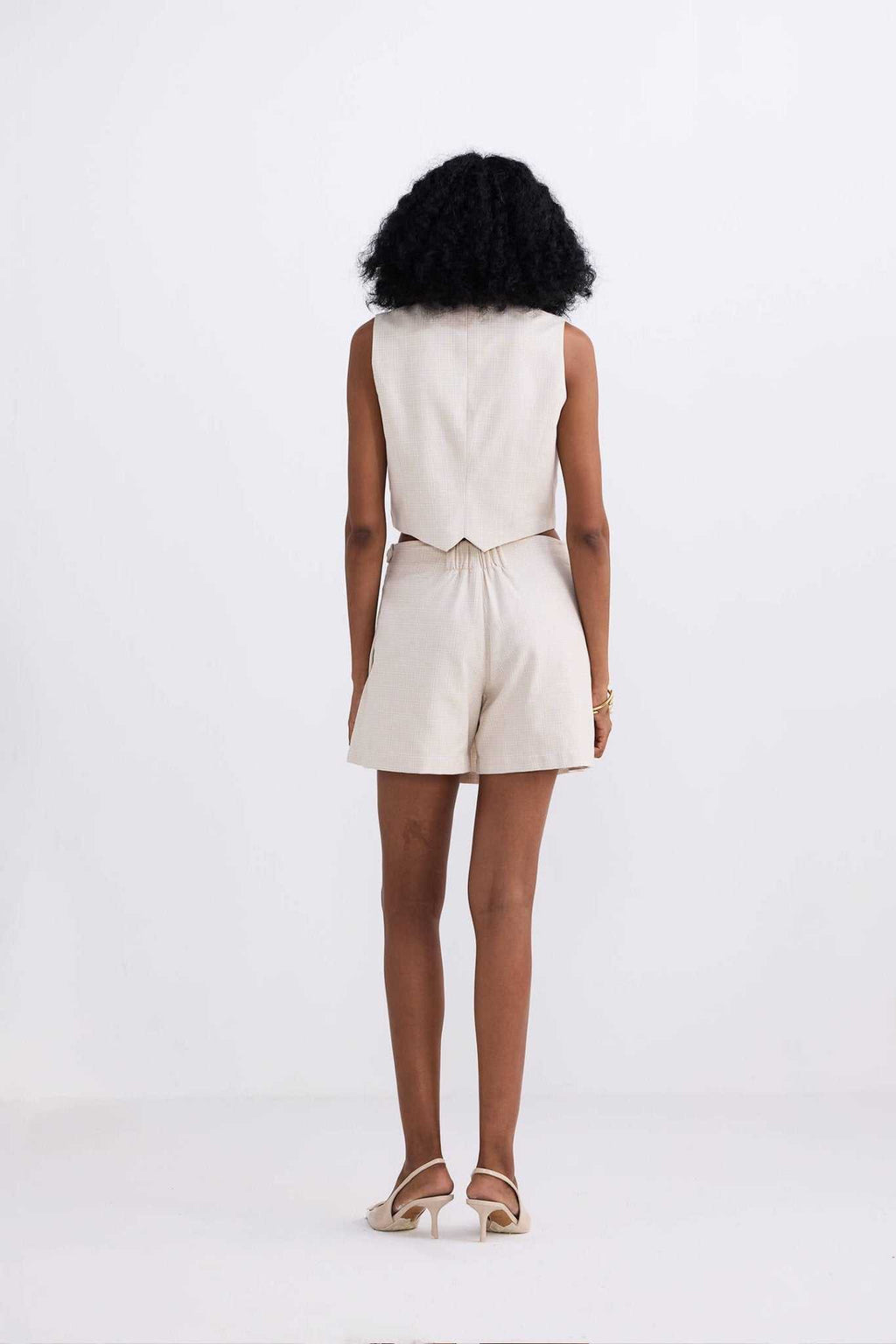 Cream cotton tweed skort, back view with waistband and center seam detailing