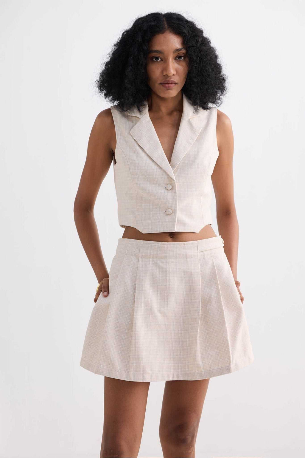 Cream cotton tweed skort, A-line silhouette with front pleats and waistband