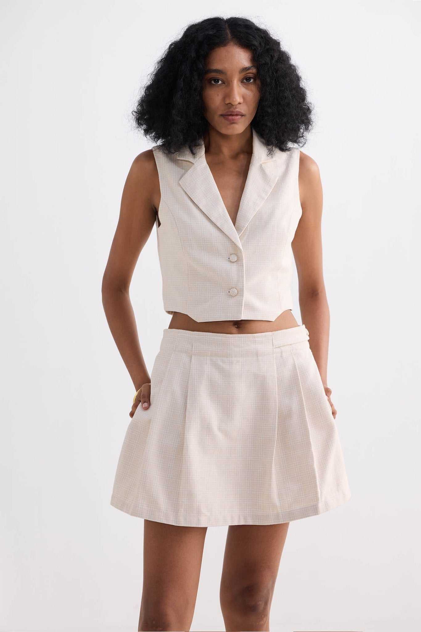 Cream cotton tweed skort, A-line silhouette with front pleats and waistband