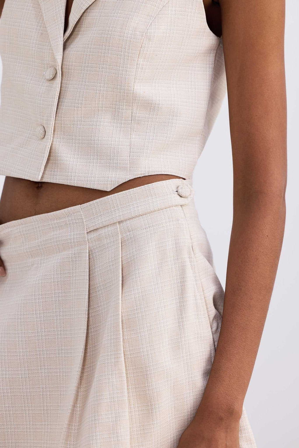 Cream cotton tweed skort fabric detail with pleats and stitched panel seams