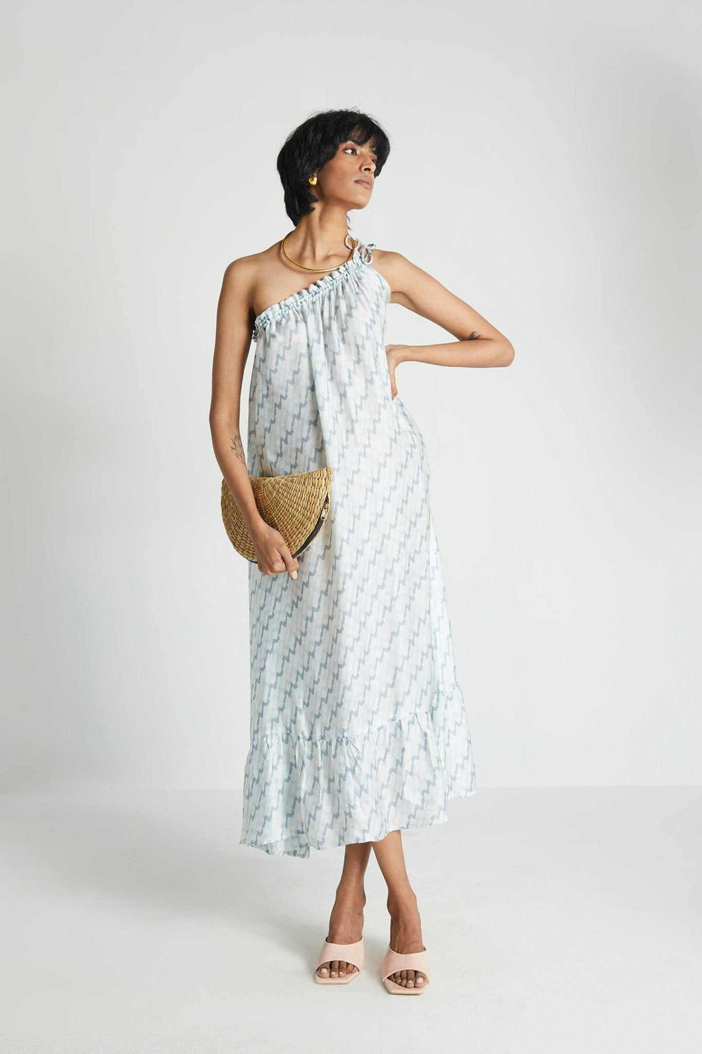 Moonlight Dress: three-quarter view, one-shoulder gathered midi, light blue lightning print