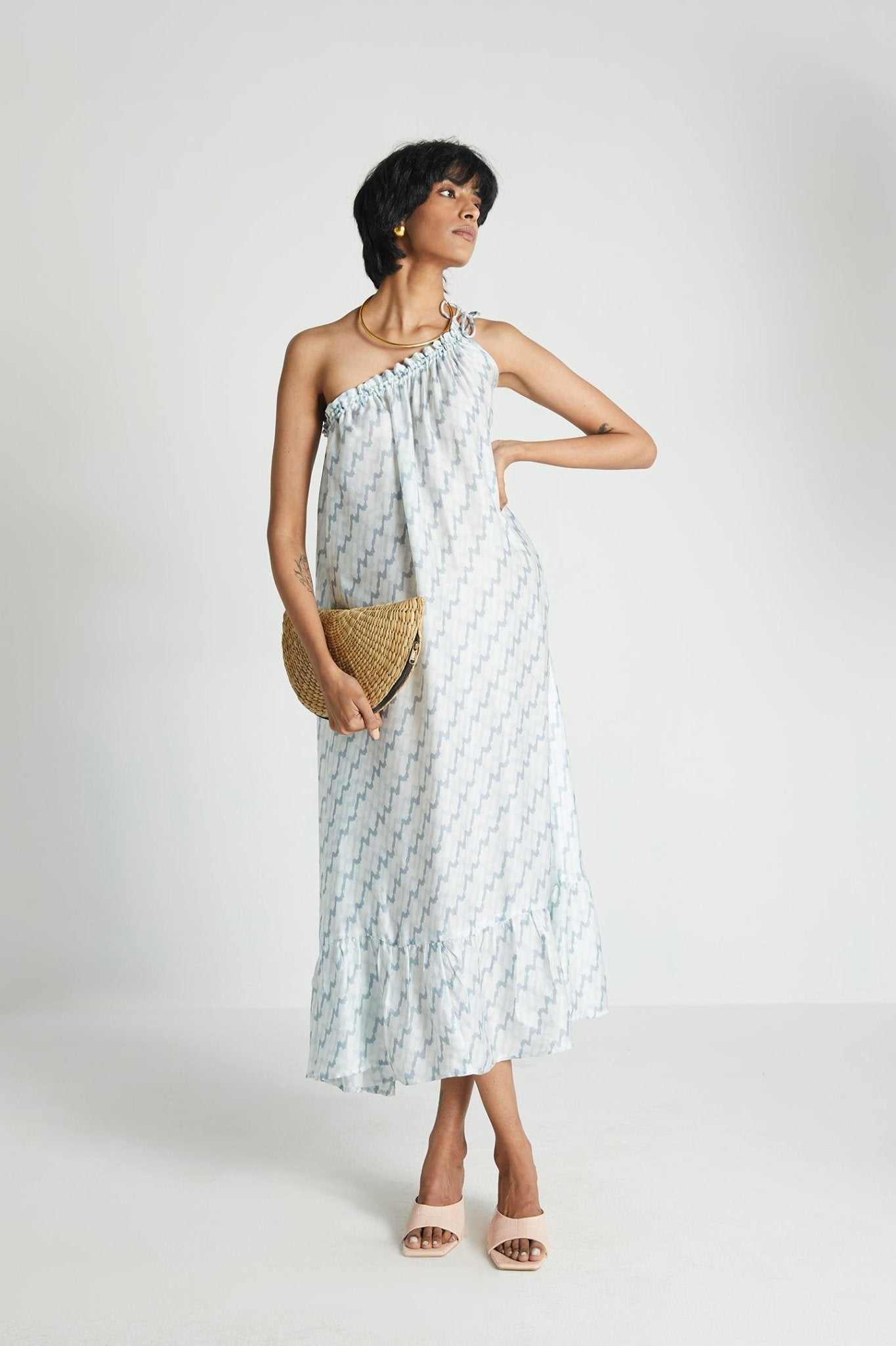 Moonlight Dress: three-quarter view, one-shoulder gathered midi, light blue lightning print