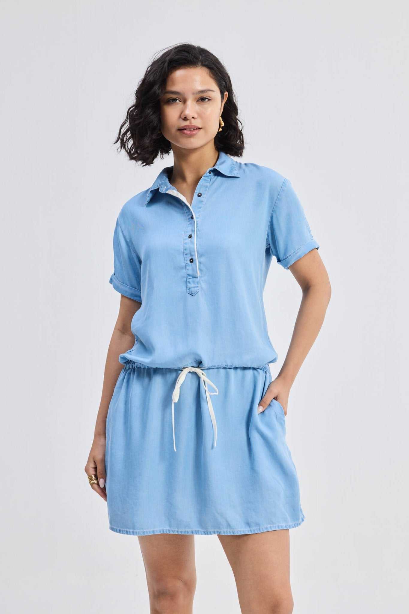 Blue denim shirt dress with collared neckline and drawstring waist tie