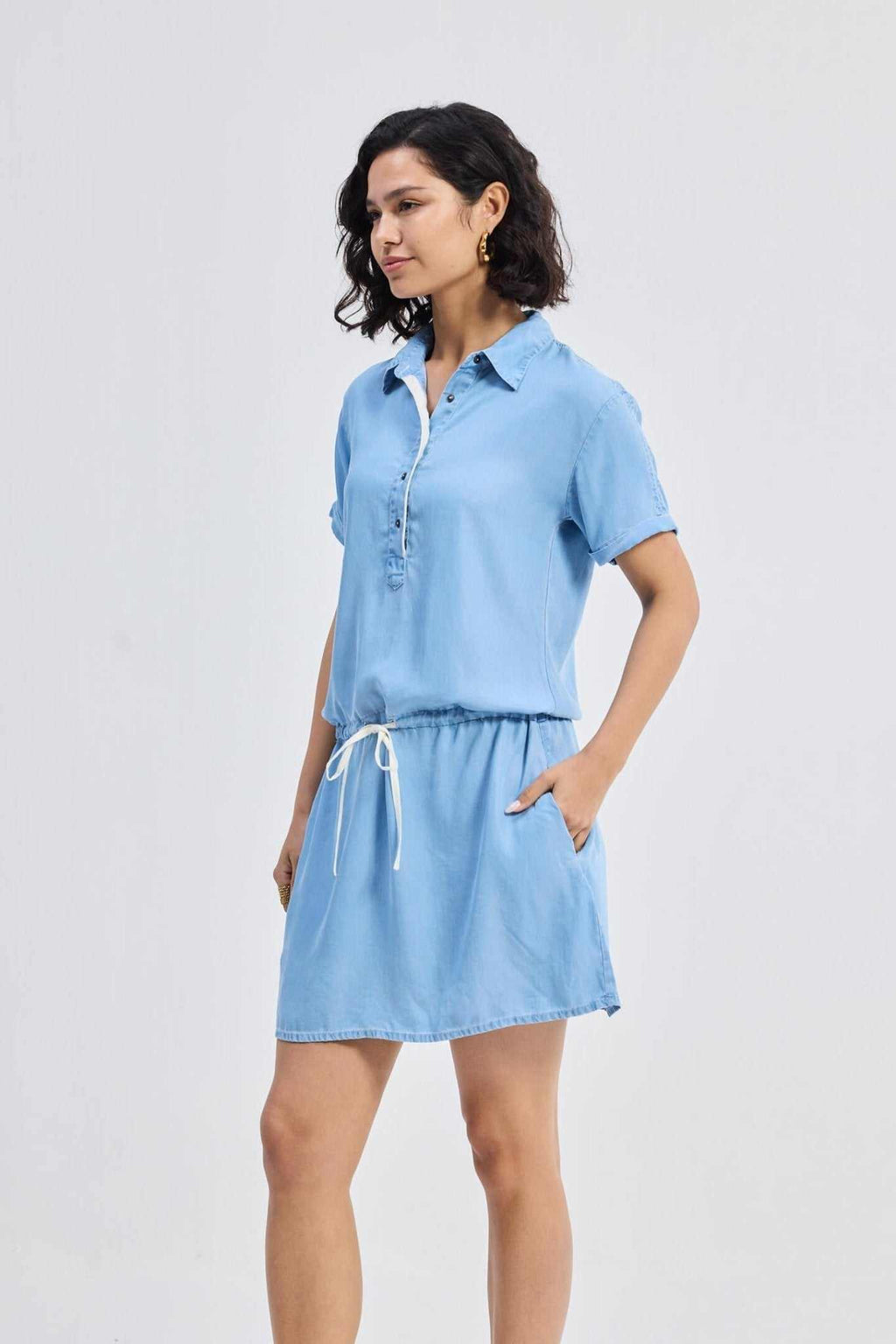 Blue denim shirt dress front with short sleeves and drawstring waist tie