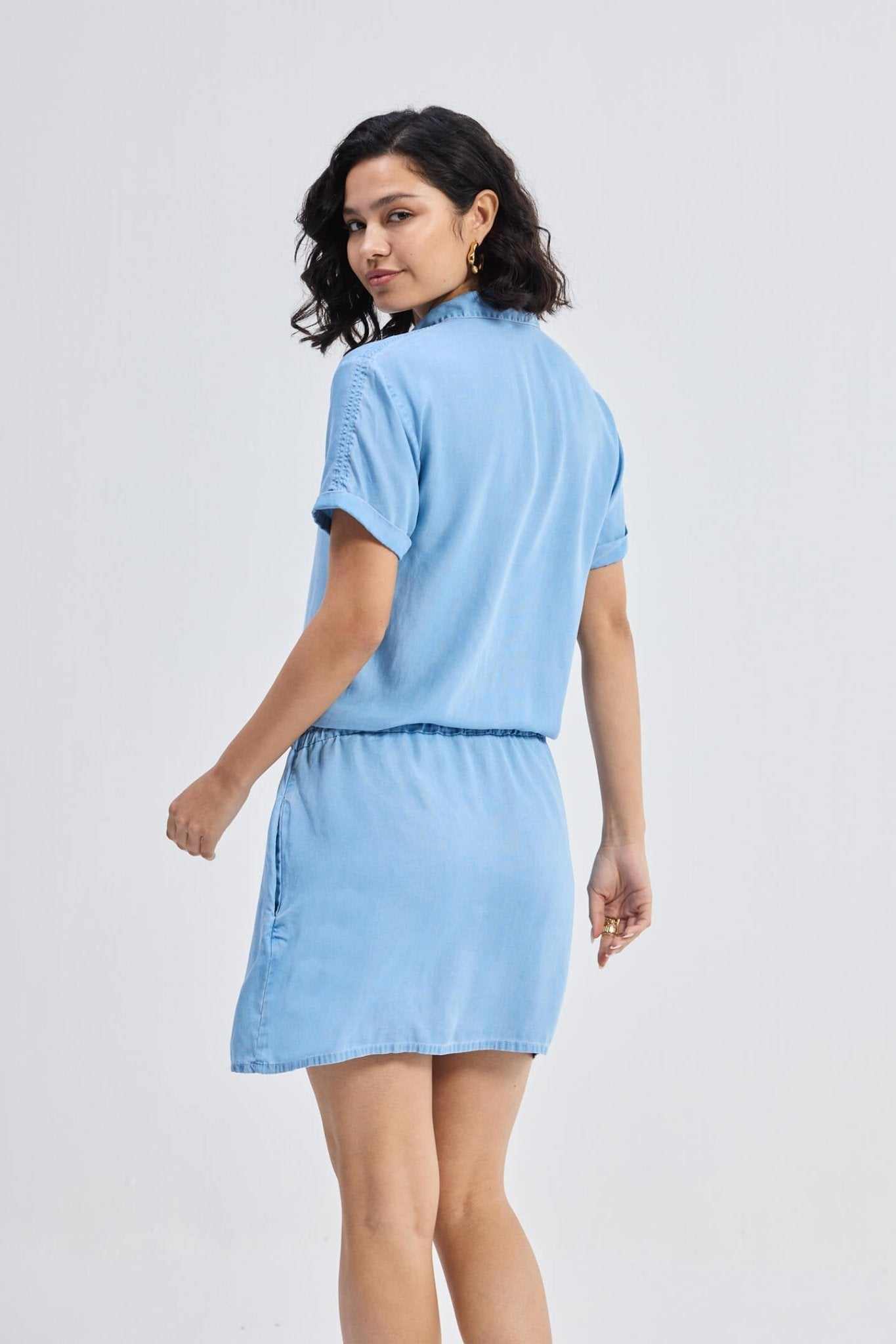 Blue denim shirt dress back view with drawstring waist and short sleeves