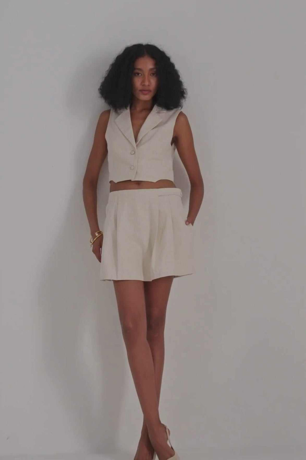 Cream cotton tweed skort with pleated front and flared skirt hem