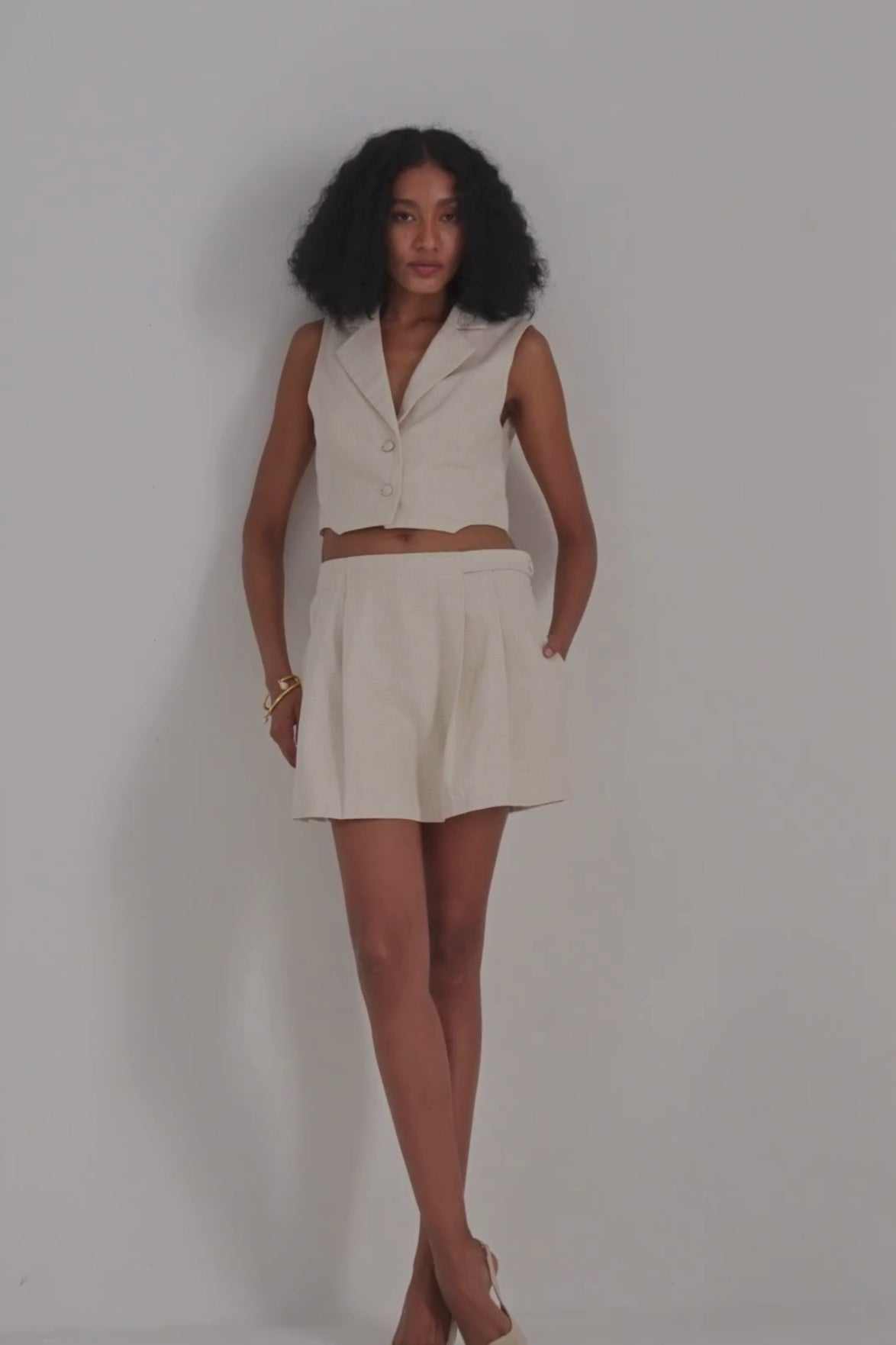 Cream cotton tweed skort with pleated front and flared skirt hem