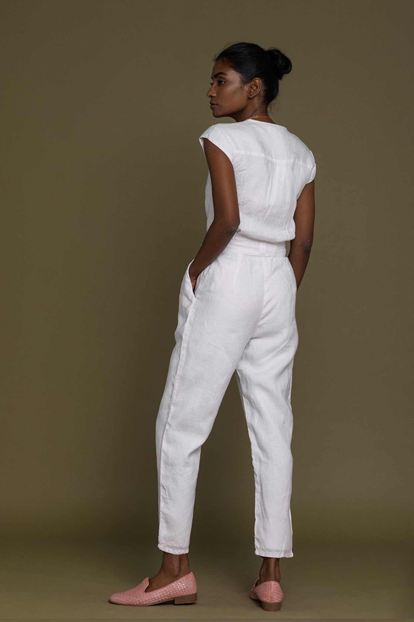 White Evening Chai jumpsuit, side view with tapered cropped legs and waist tie