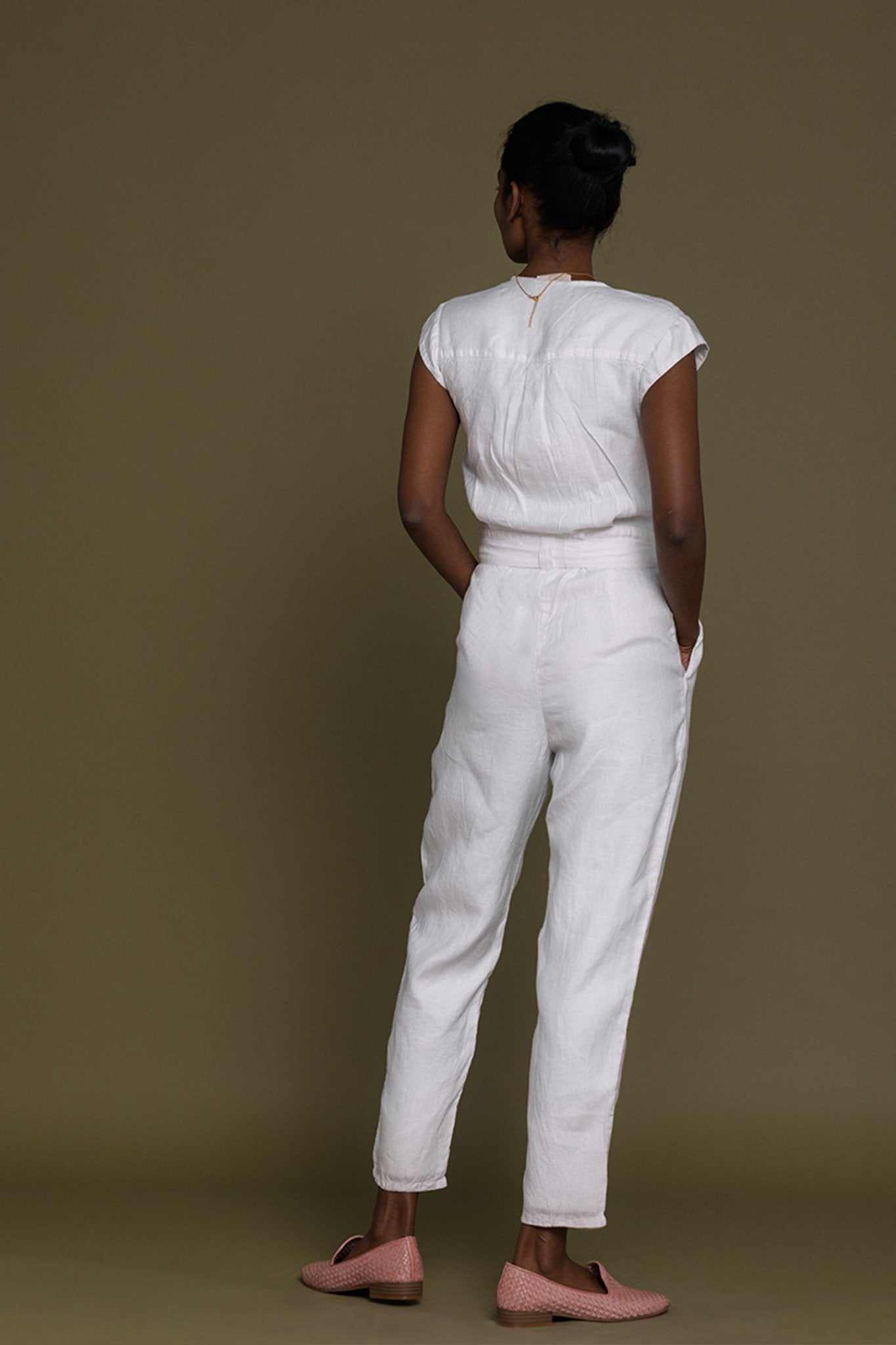 White Evening Chai jumpsuit, back view with cap sleeves and tied waist