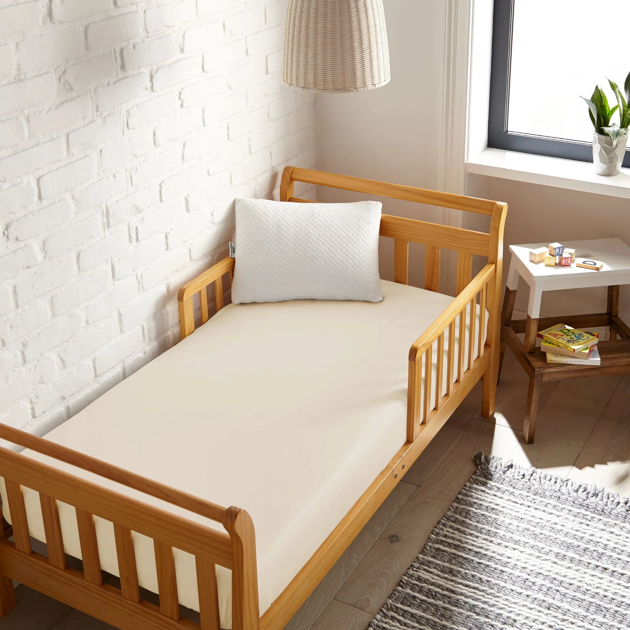 White cooling bamboo crib fitted sheet on crib mattress, snug fitted look