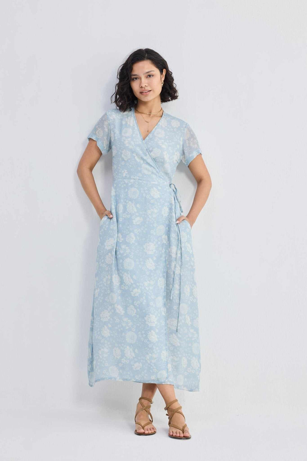 Light-blue floral wrap maxi dress with short sleeves and draped, tied waist