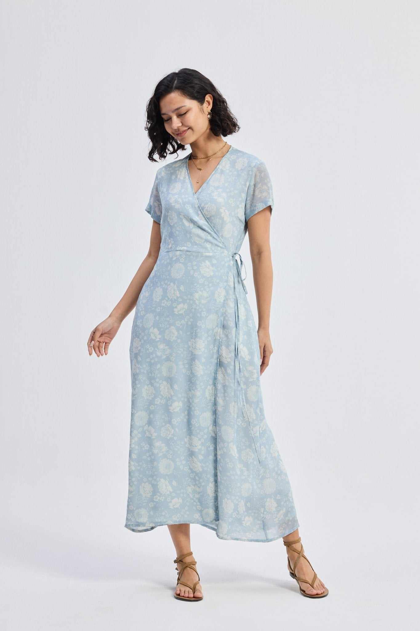 Light-blue floral wrap maxi dress with V-neckline and adjustable waist tie