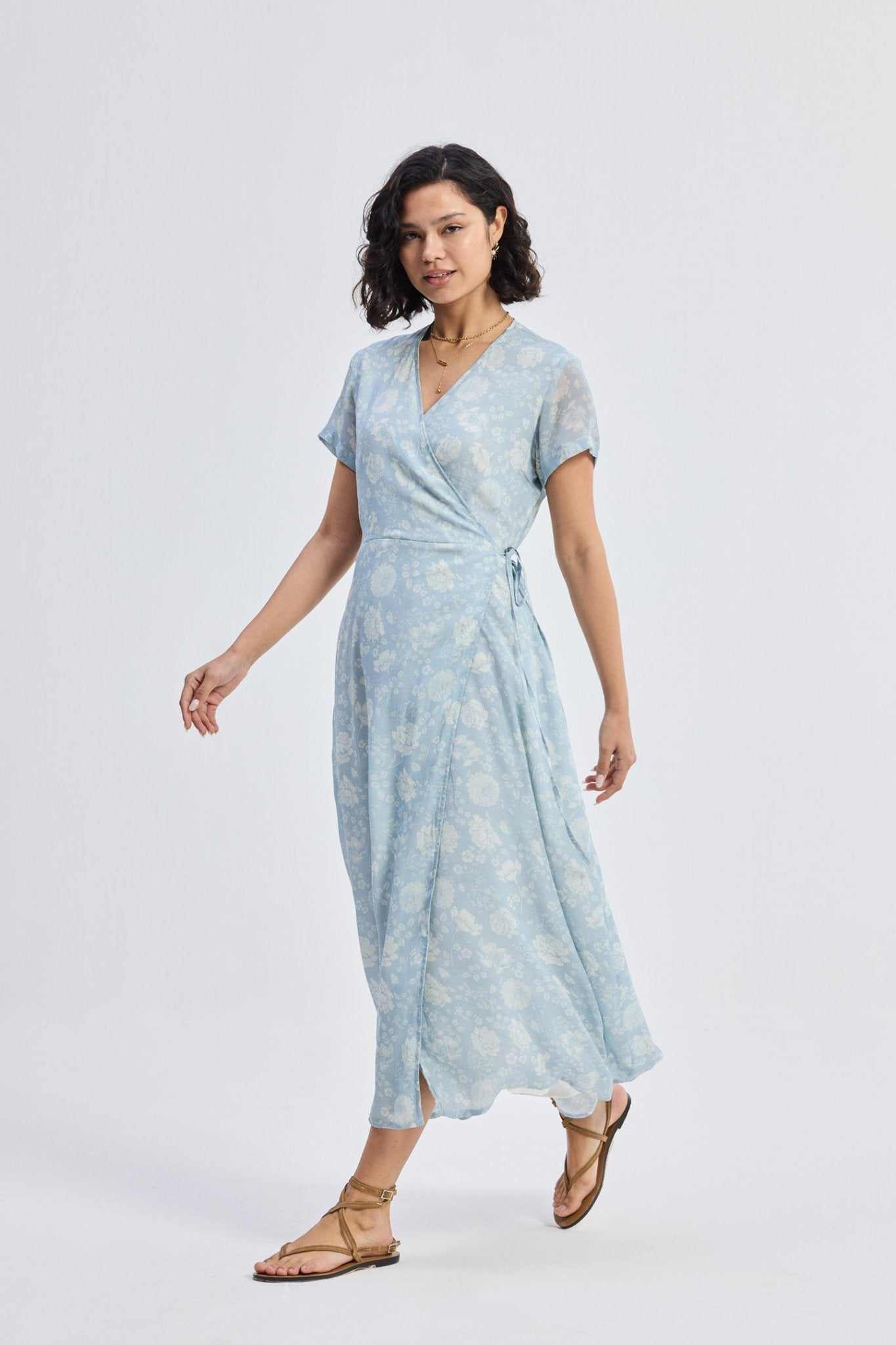 Maxi wrap dress with light-blue floral print, V-neck, and front slit