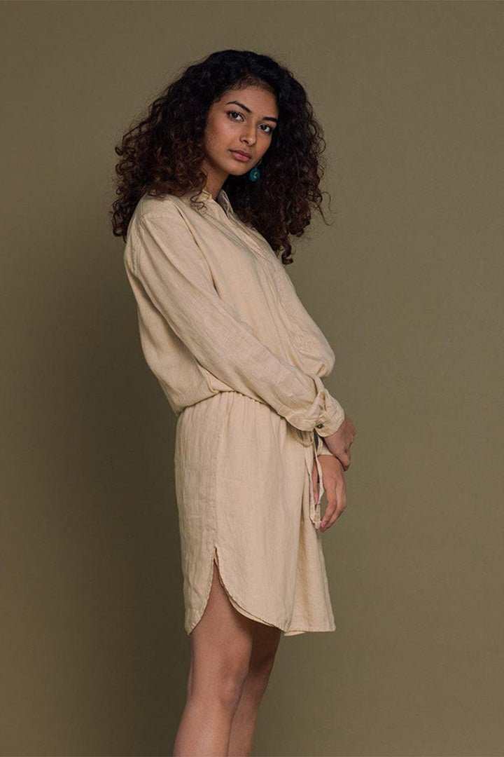 Meet Me by the Cliff Dress side view: neutral beige mini with front slit