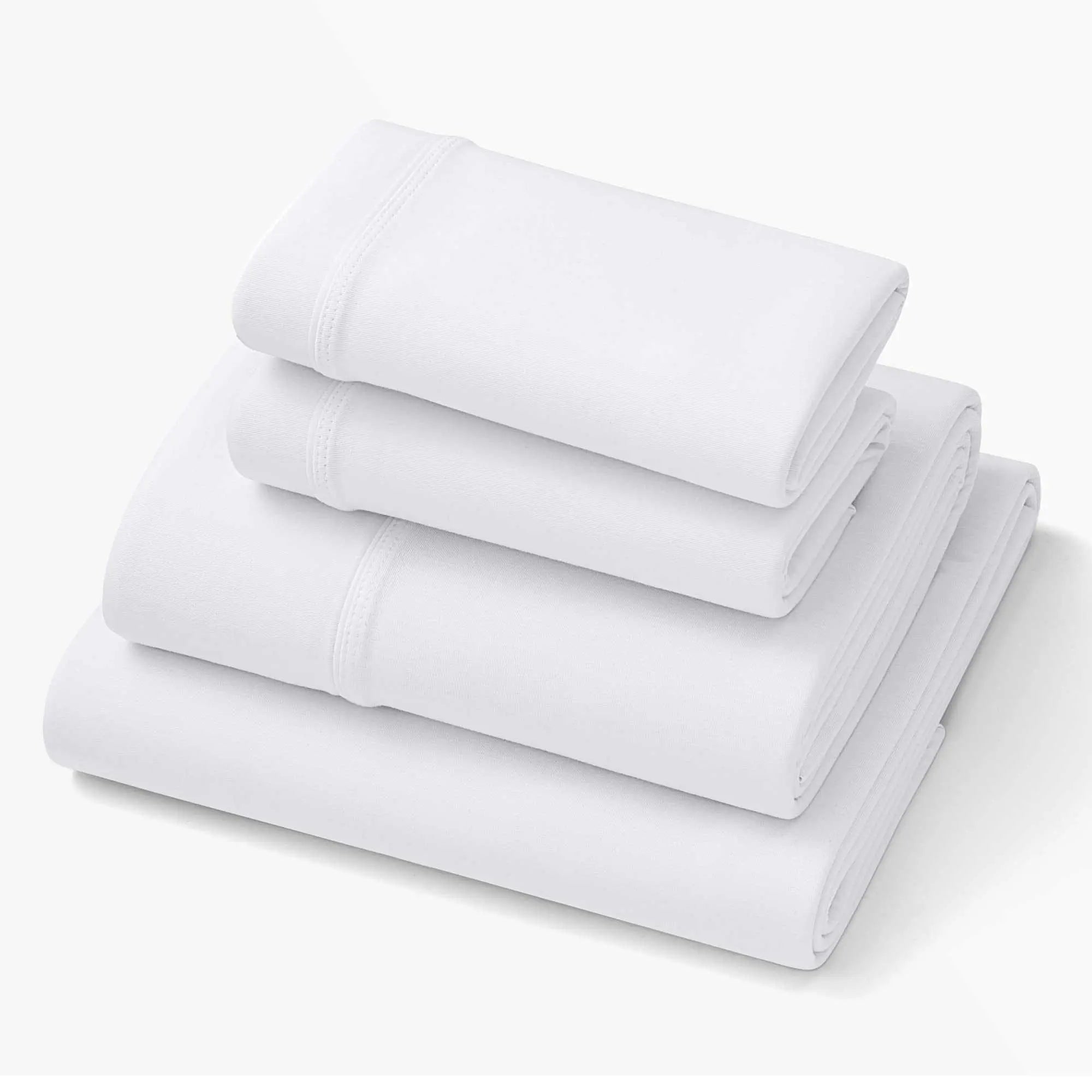 SoftStretch deep-pocket sheets, light white tone, rolled folds with stitched border