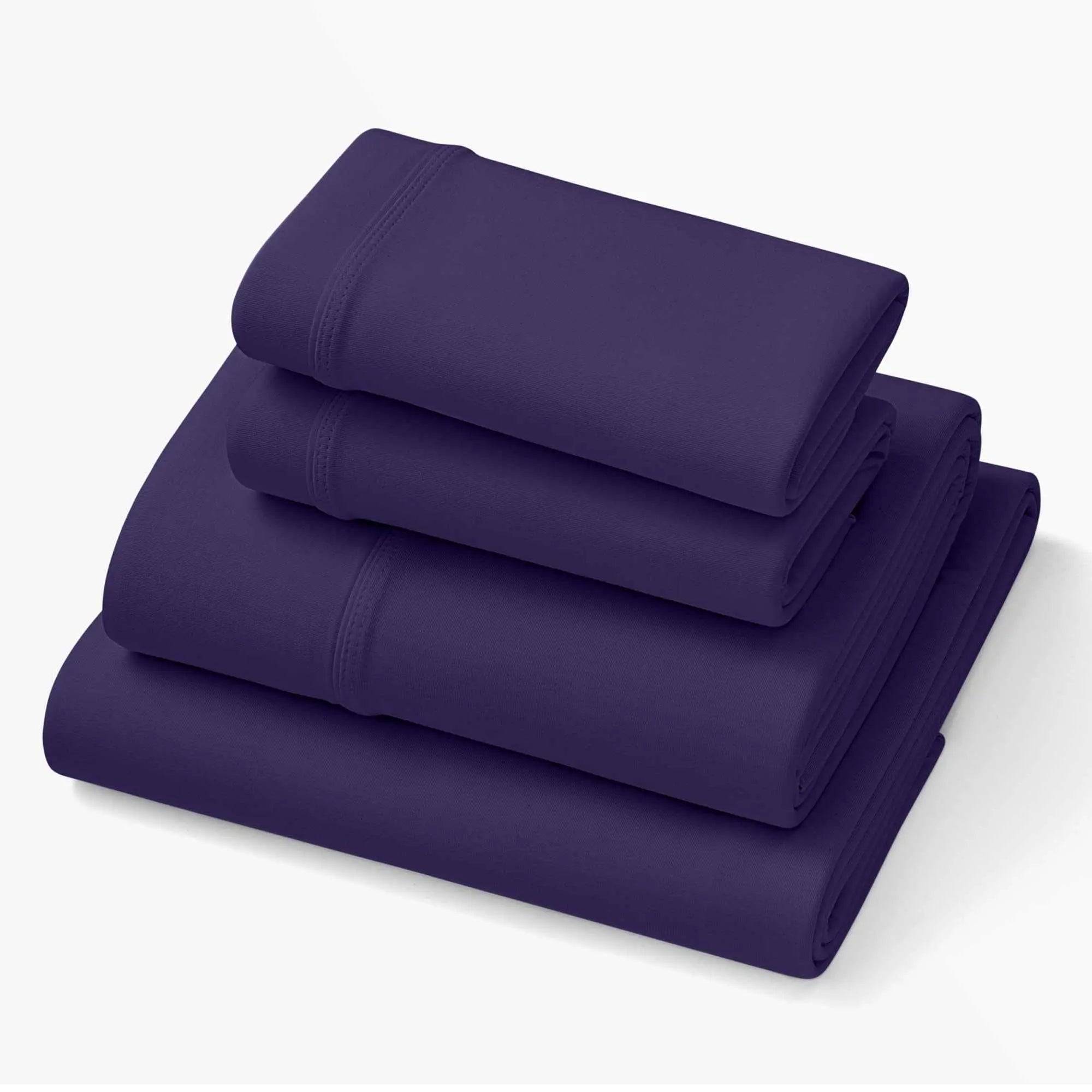 Deep Purple sheets set in folded stack, elastic fitted-edge seam visible along sides