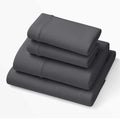 Stormy Grey deep-pocket sheets set, three folded layers showing elastic hem edging