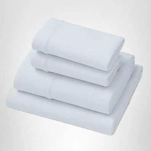 Light blue-grey deep pocket softstretch sheets, folded stacks
