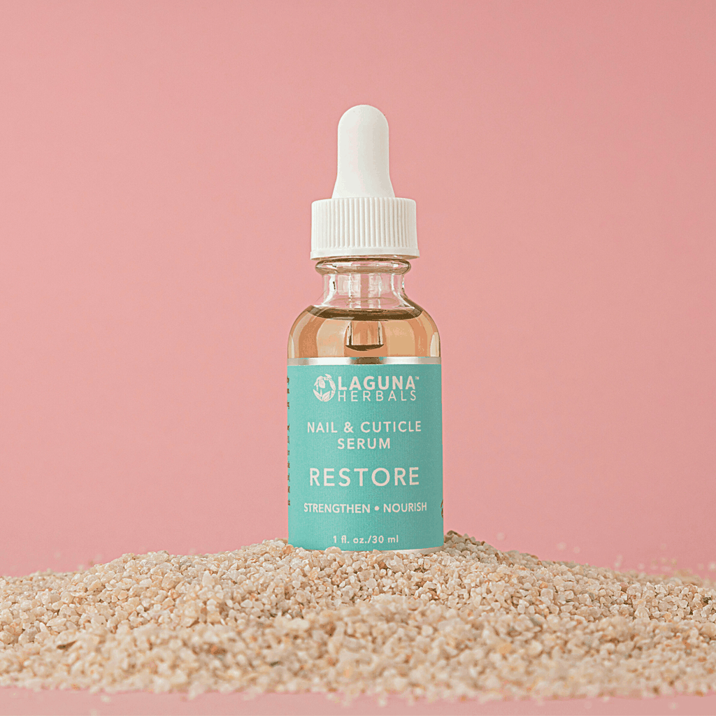 Laguna Herbals Restore cuticle oil serum in amber glass bottle with white dropper cap