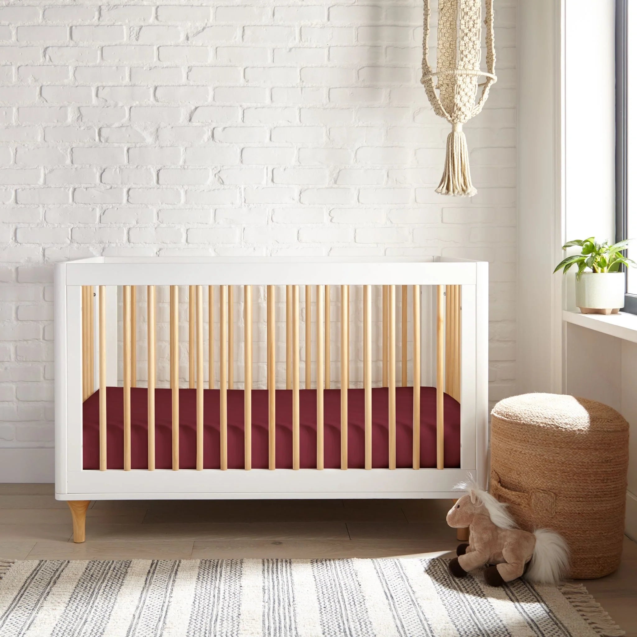 Crib fitted sheet, RUBY RED bamboo fabric; snug elastic edges along corners.