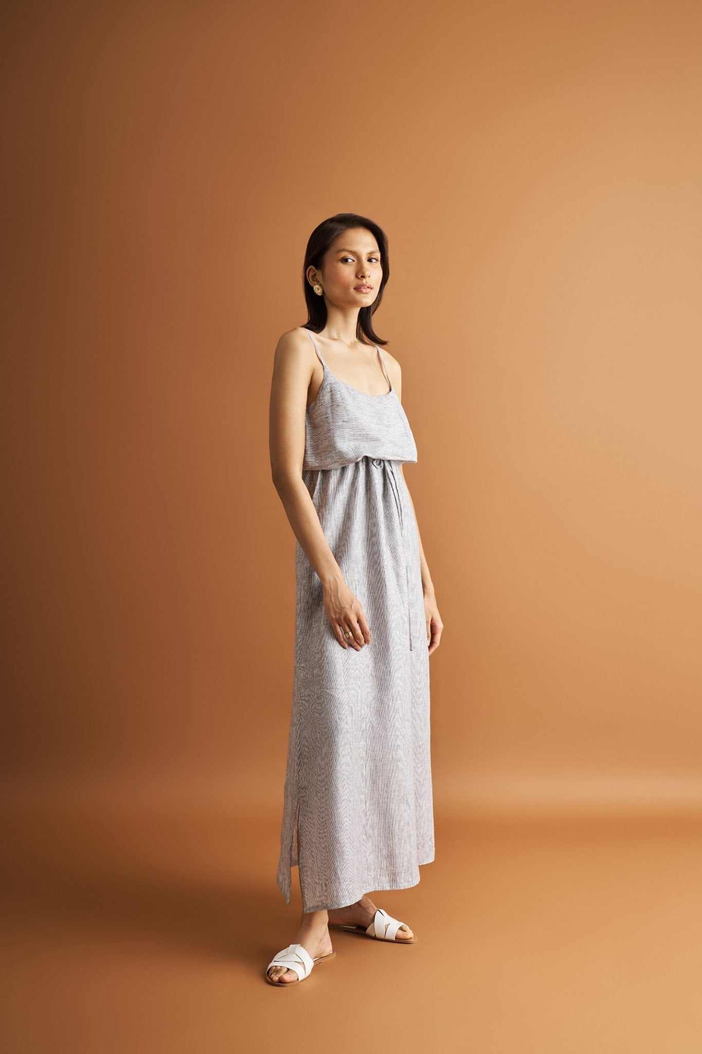 DC-Reistor pinstriped linen maxi dress with spaghetti straps and gathered waist ruffle