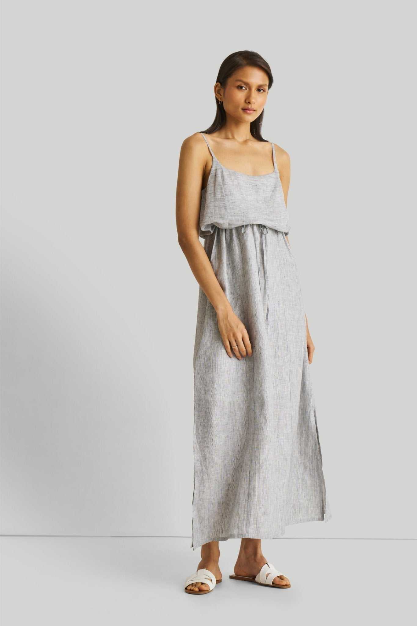 Strappy pinstriped maxi dress with spaghetti straps, waist ruffle, and long skirt