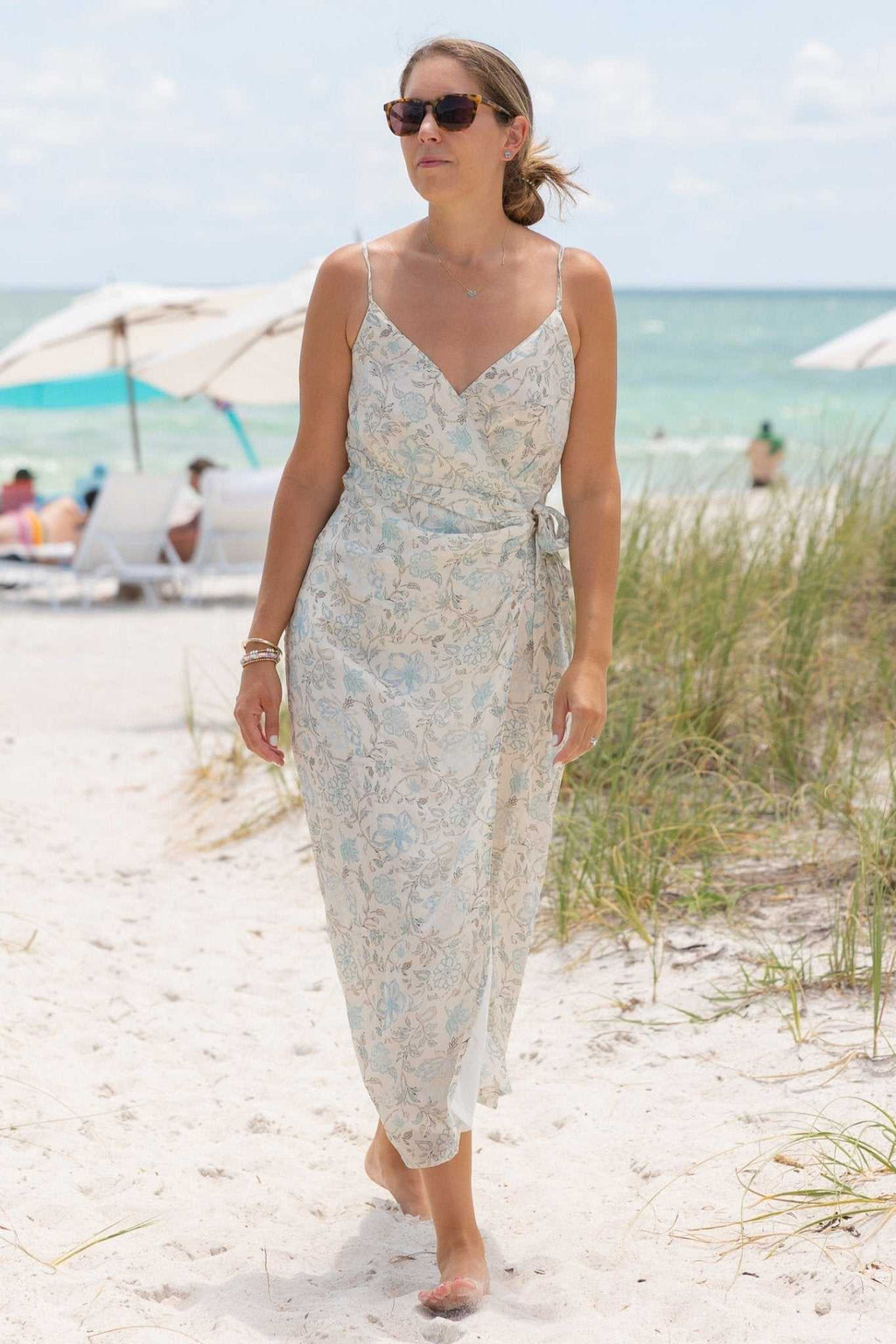 Blue floral wrap midi dress with thin straps and tie waist, V-neck bodice